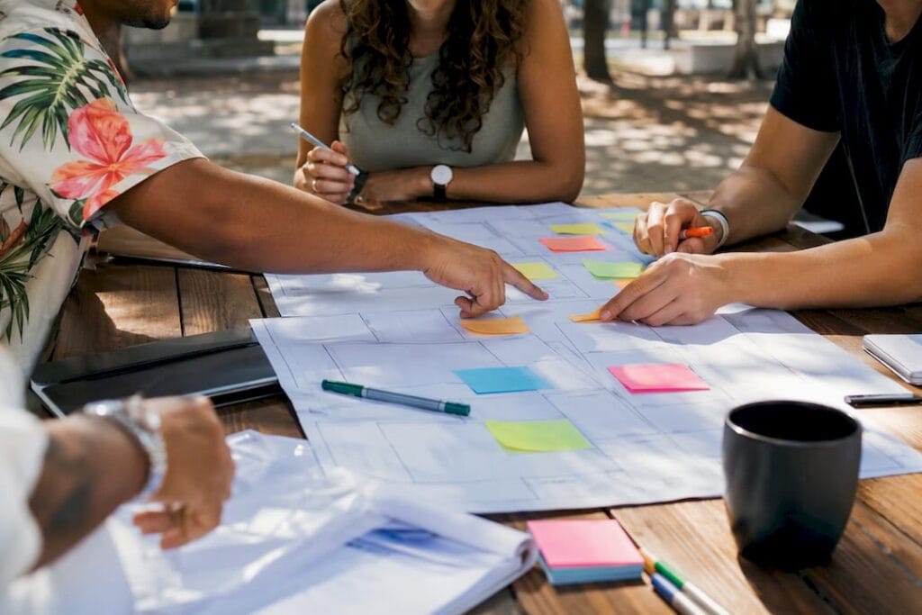 Hands collaborating on business frameworks