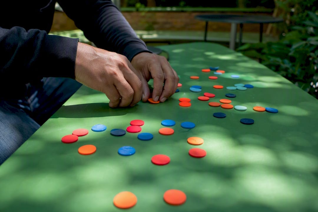 Hands adjusting pricing strategy counters