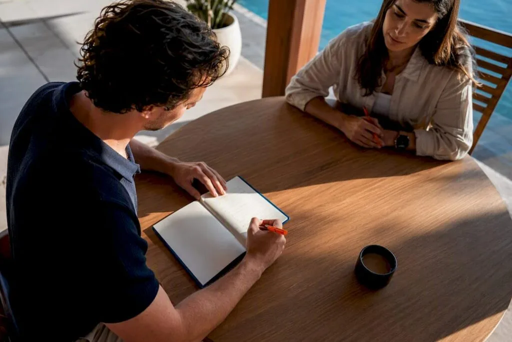 Founder writing a business goal with accountability